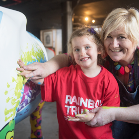 Children paint Rainbow Trust Children’s Charity’s cow for CowParade Surrey thumbnail