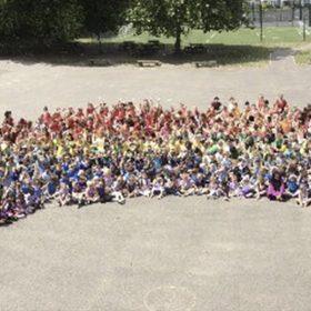Danetree School's human rainbow in aid of seriously ill children thumbnail