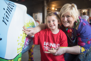 Children paint Rainbow Trust Children’s Charity’s cow for CowParade Surrey image