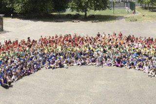 Danetree School's human rainbow in aid of seriously ill children image