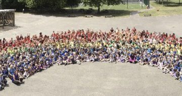Danetree School's human rainbow in aid of seriously ill children image
